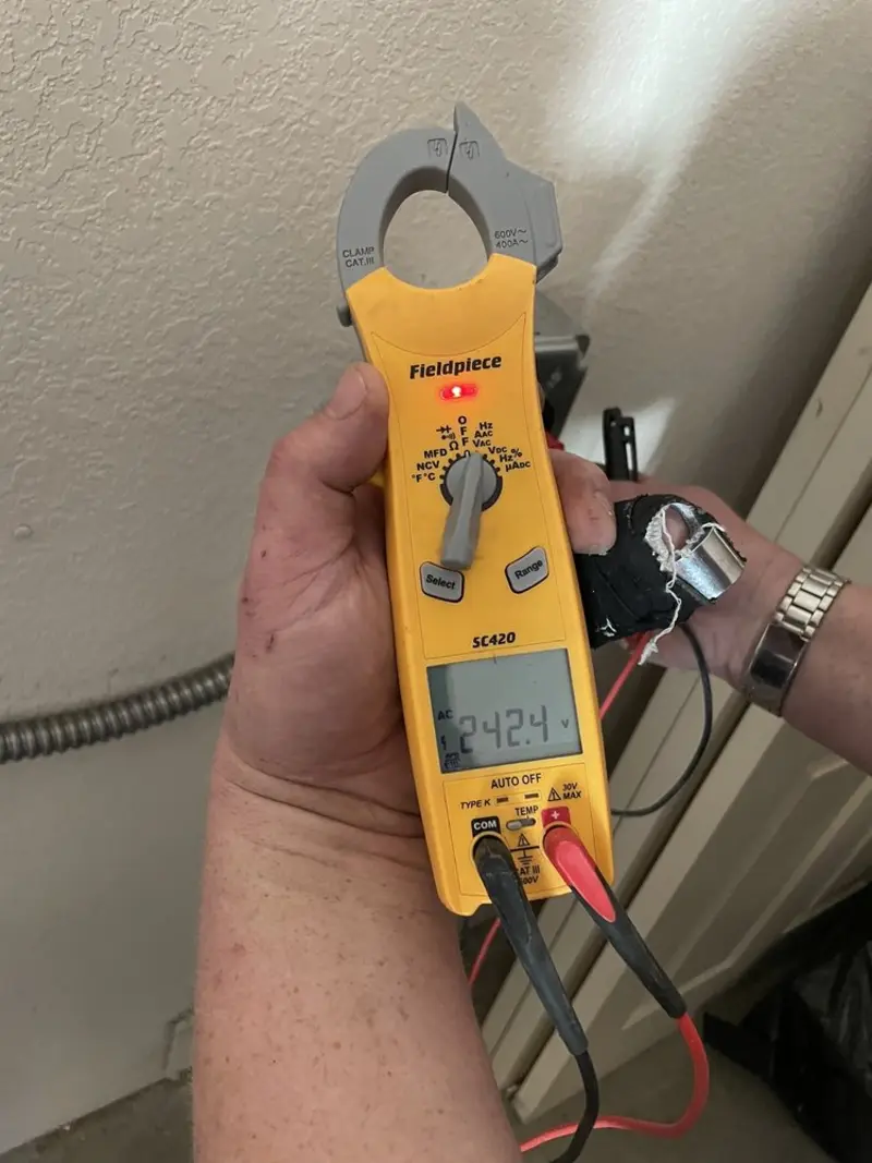 Voltage testing with clamp meter during Ceiling Fan Installation in Bessemer City